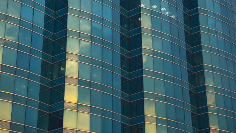sunset reflection on glass windows of a business building
